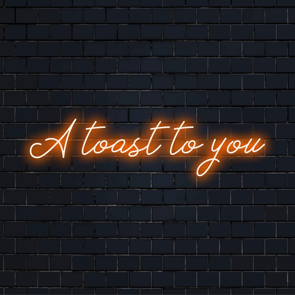 Anpassad LED-neonskylt med frasen A Toast To You i livfulla färger, perfekt för att sätta en festlig touch till vilket utrymme som helst.