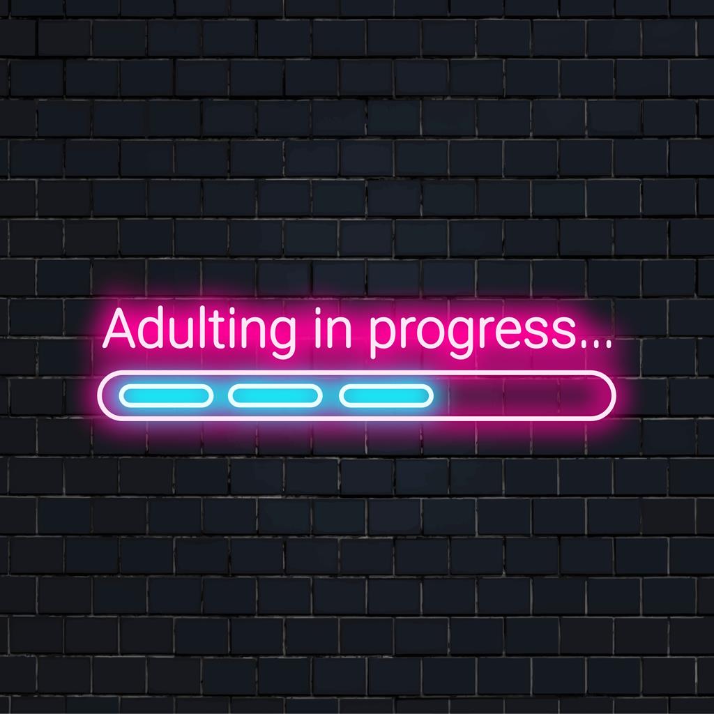Anpassad LED-neonskylt med texten "Adulting In Progress..." i ljus vit, perfekt neonljusdekor för moderna utrymmen.