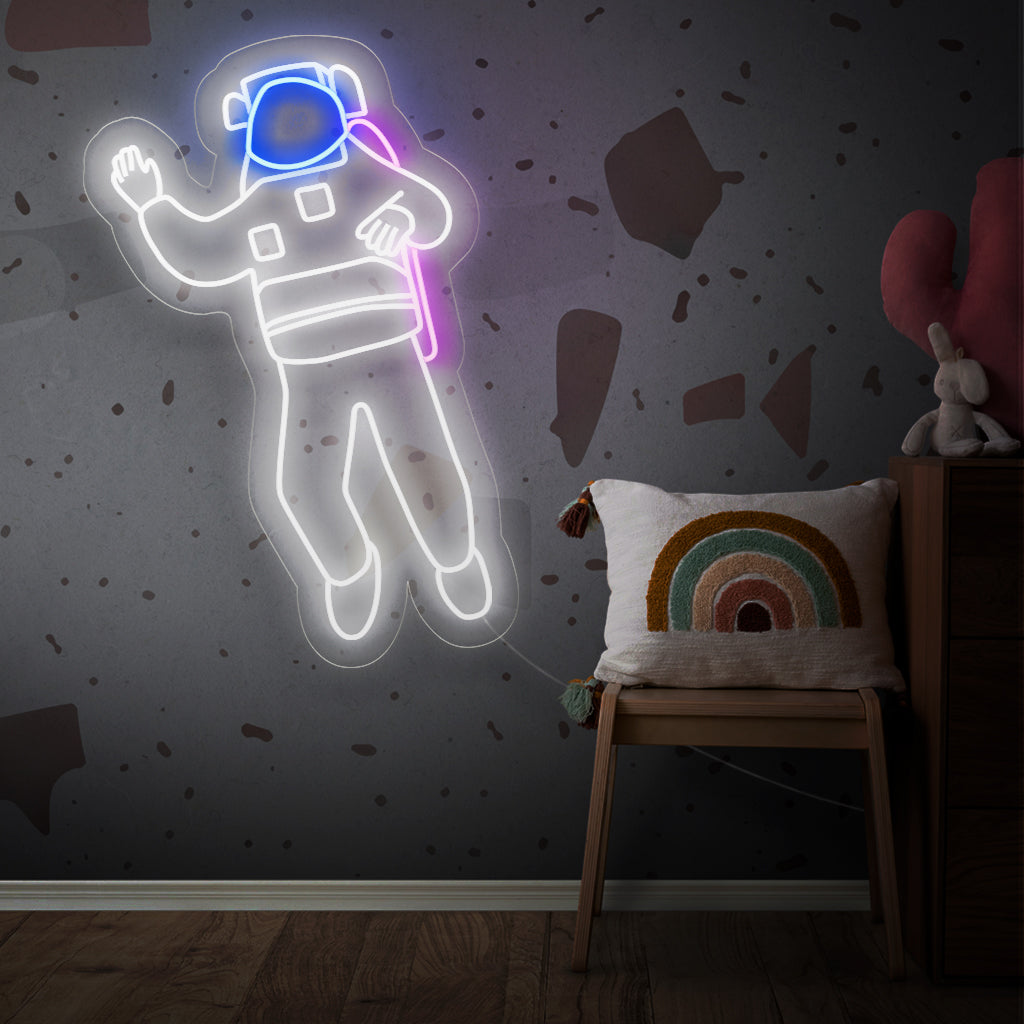 "Astronaut Neon Sign" - Ett kosmiskt neonljus med den ikoniska representationen av en astronaut, som ingjuter interstellärt under och en känsla av utforskande i ditt livsrum.