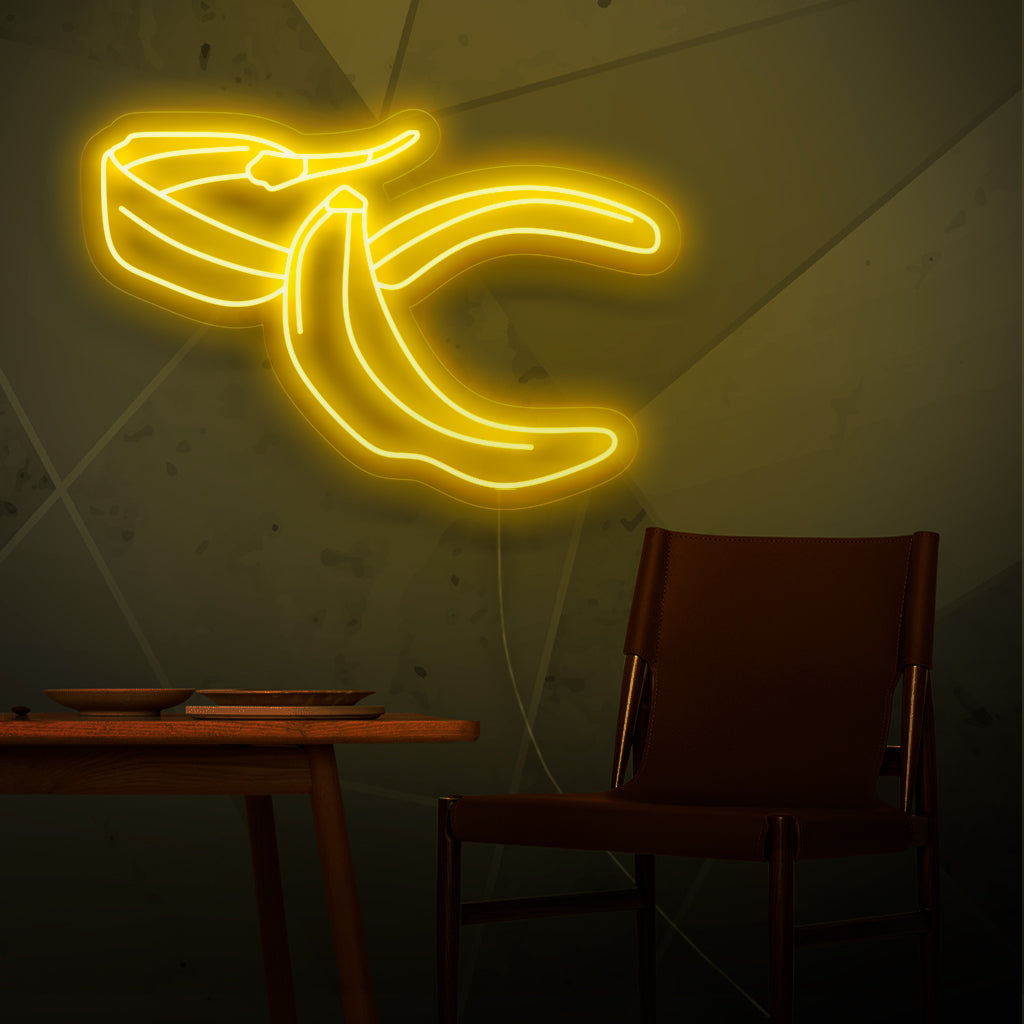 "Banana Peel Neon Sign" - Ett udda neonljus med den lekfulla representationen av ett bananskal, som ingjuter humor och lättsamhet i ditt vardagsrum.
