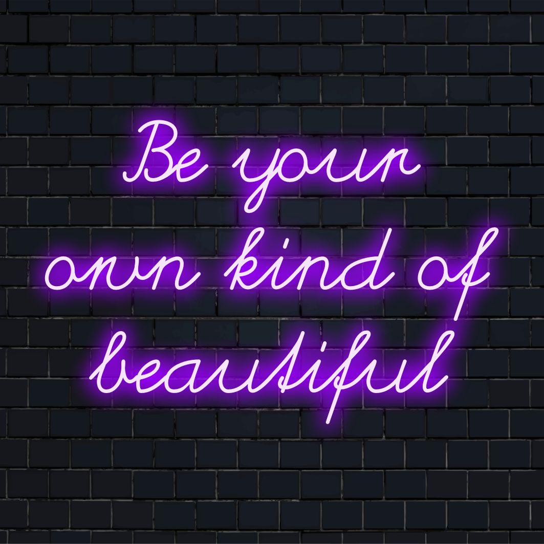 Anpassad LED-neonskylt som visar Be Your Own Kind of Beautiful, perfekt för inspirerande väggdekor och personlig meddelandekonst.