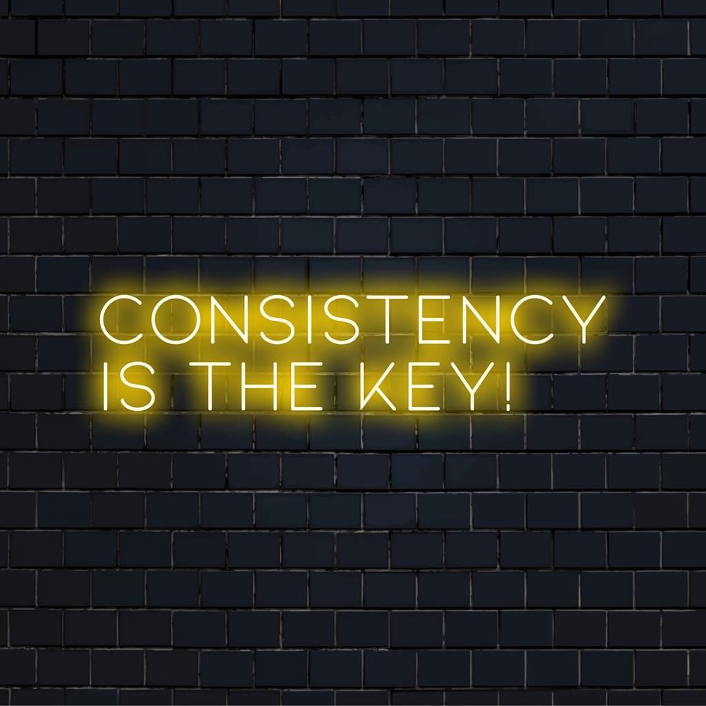 Skräddarsydd LED-neonskylt som visar "Consistency Is The Key!", perfekt för inspirerande väggdekor inomhus. Ospecifik designtyp.