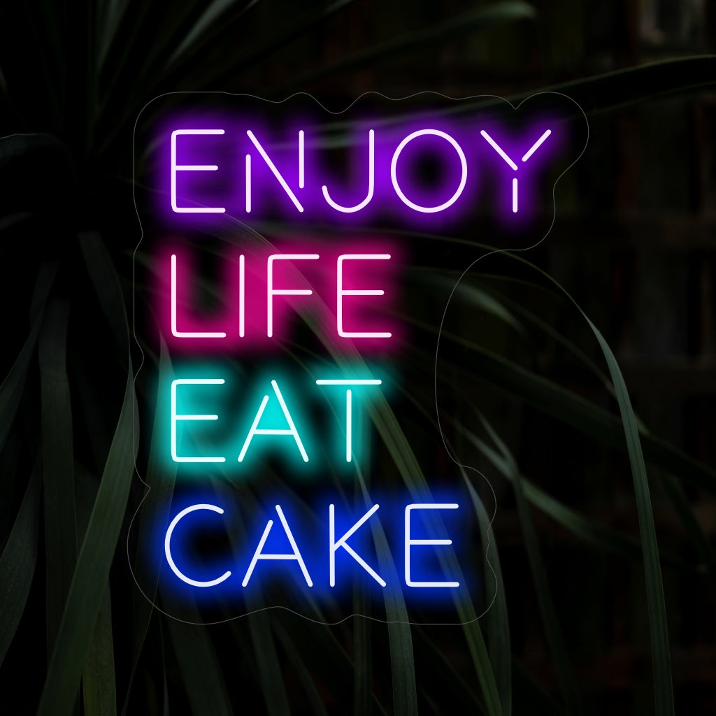 "Enjoy Life Eat Cake Neon Sign" lyser upp med ett sött sken, perfekt för bagerier och utrymmen som firar livets glädjestunder.