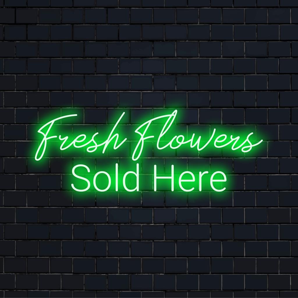 Ljus och inbjudande, denna specialtillverkade LED-neonskylt läser Färska blommor som säljs här för en iögonfallande detaljhandelsvisning.