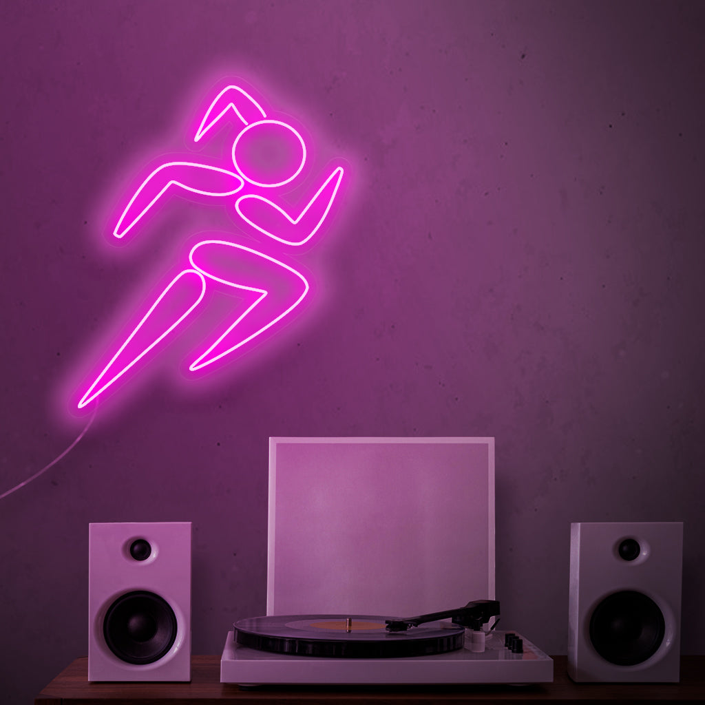"Girl Running Neon Sign" - Fångar den dynamiska energin hos en löpare, perfekt för träningsutrymmen och gym, inspirerande till en aktiv och hälsosam livsstil.