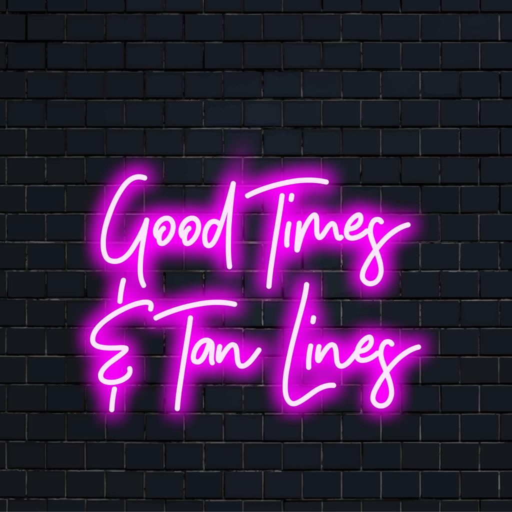 Levande LED-neonskylt som läser Good Times Tan Lines; idealisk för att lysa upp utrymmen med unik neonljusdekor.