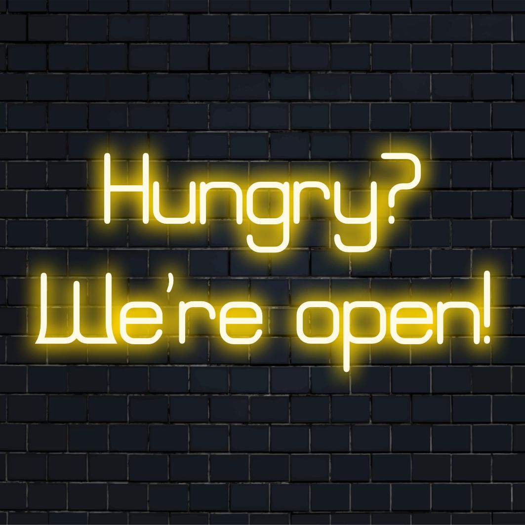 LED neonskylt med läsning Hungry We're Open! i livfulla färger, perfekt för att förstärka alla utrymmen med inbjudande neonljusdekor.