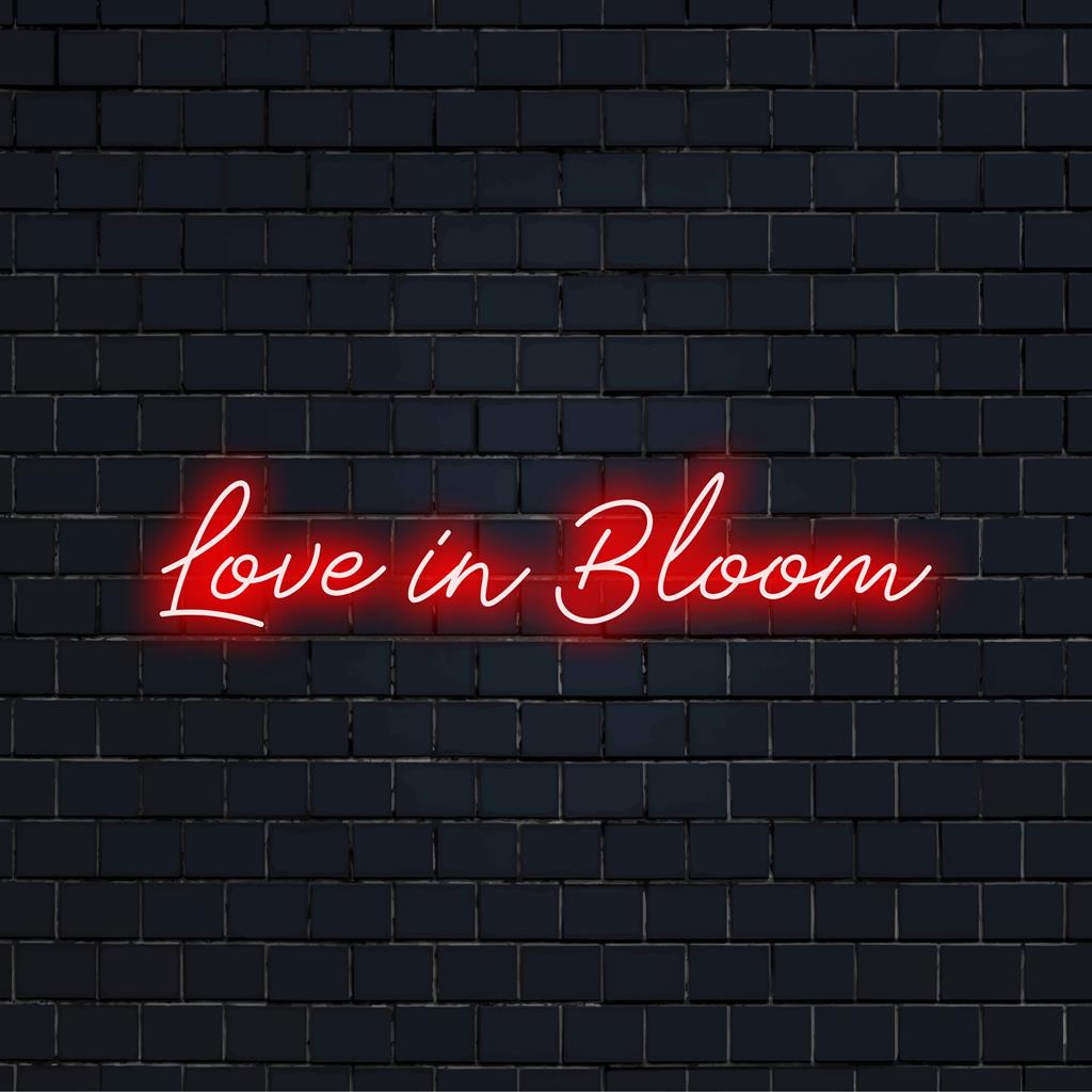 Anpassad LED-neonskylt från The Art Neon, med en livlig Love In Bloom-design, perfekt för neonväggdekoration.
