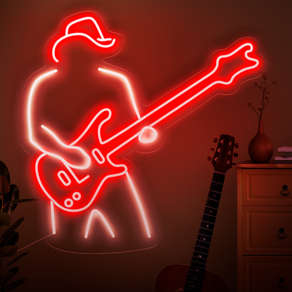 "A Man Plays The Guitar Neon Sign" fångar essensen av musikalisk passion med en siluett som klumpar på en gitarr. Lyft upp ditt utrymme med den rytmiska glöden från detta eleganta och fängslande neonljus.