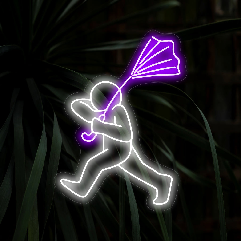 "Man Tries To Hold His Umbrella Neon Sign" är ett udda och humoristiskt tillägg för utrymmen med en touch av nyckfullhet. Lys upp med en lekfull atmosfär!