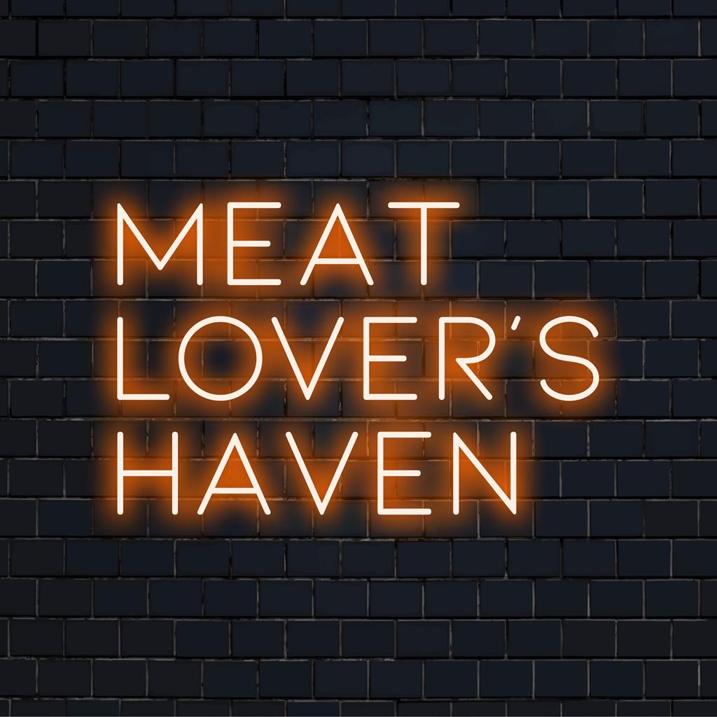 Skräddarsydd LED-neonskylt som läser Meat Lover's Haven, som kombinerar levande neonnyanser för en slående visuell effekt.