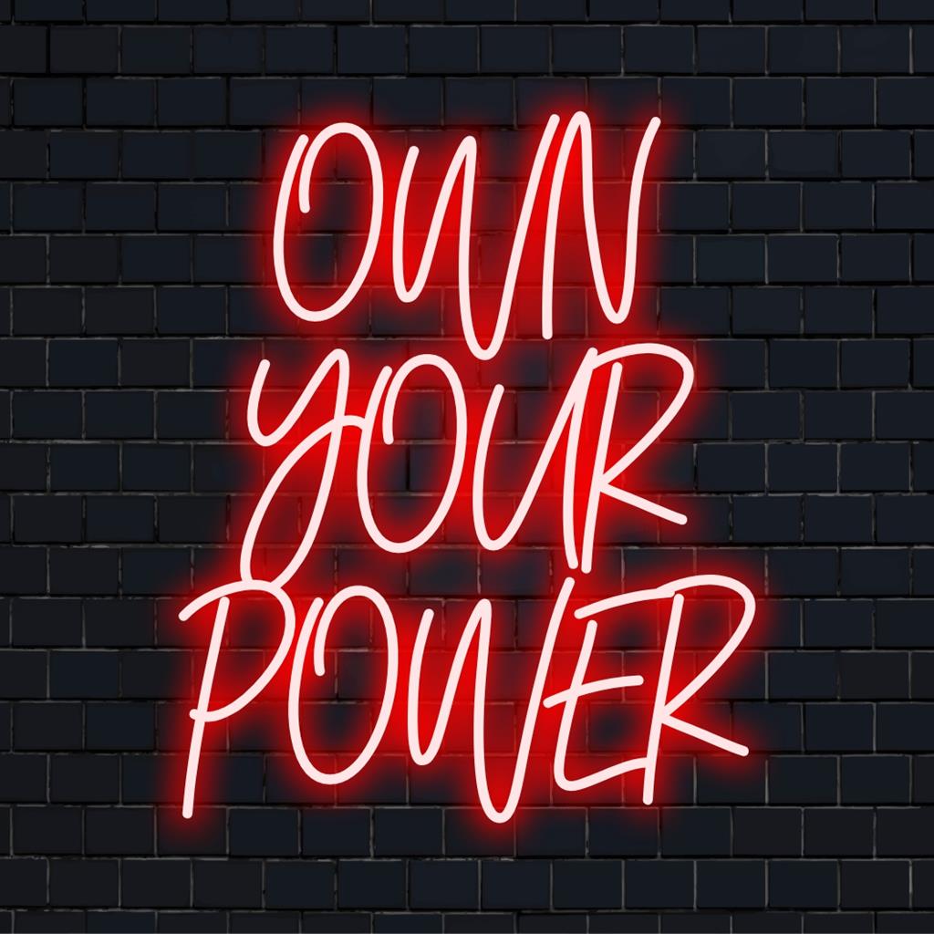 LED neonskylt med frasen Own Your Power i glödande text; inspirerande neonkonst för personlig inredning.