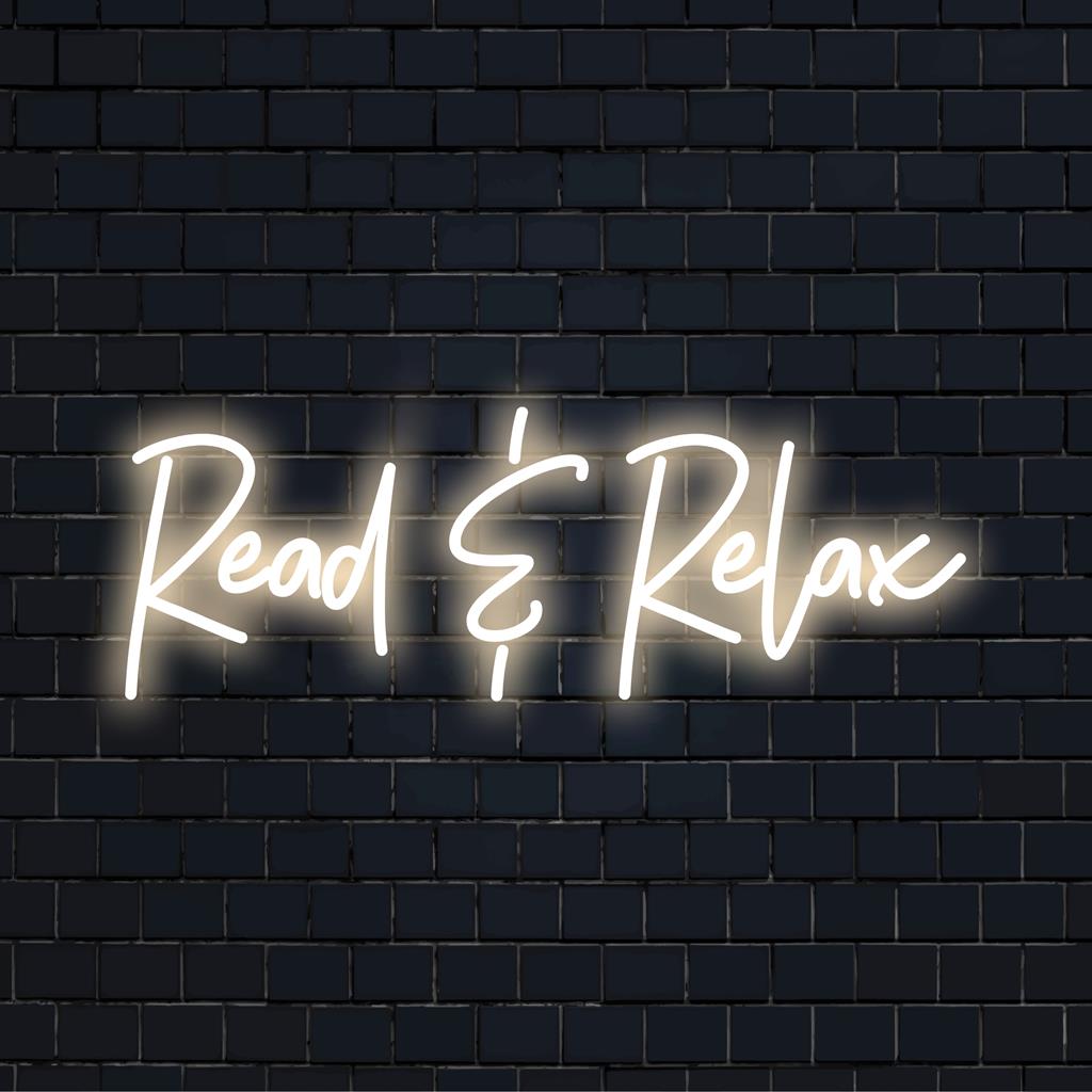 LED-neonskylt med "Read Relax", som kombinerar mjuk glöd och modern design för att förstärka alla utrymmen med omgivande ljus och elegant inredning.