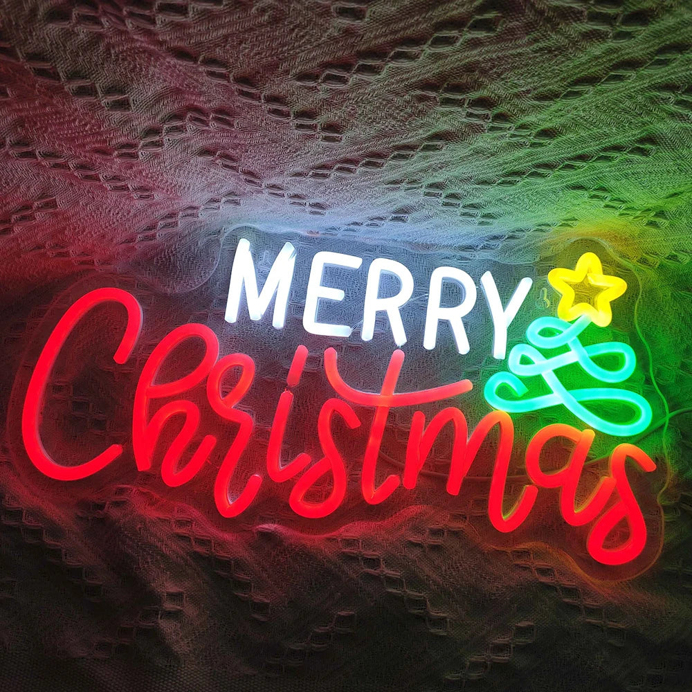 Bilden har en levande, handgjord LED-neonskylt som stavar "god jul" med elegant, flytande manus.