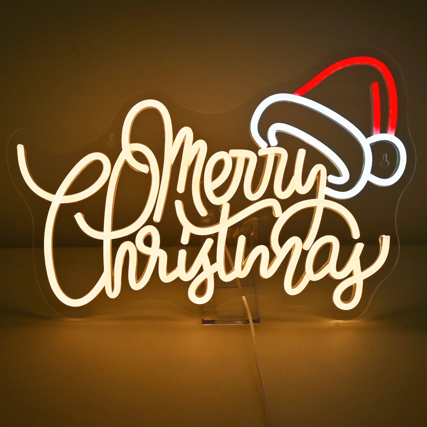 En livlig LED-neonskylt som visar orden "God Jul" i en varm, glödande nyans.