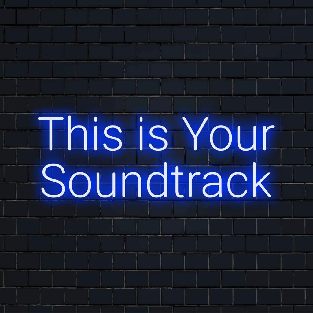 En levande LED-neonskylt med frasen This Is Your Soundtrack, perfekt som personlig neonväggkonst eller dekor.