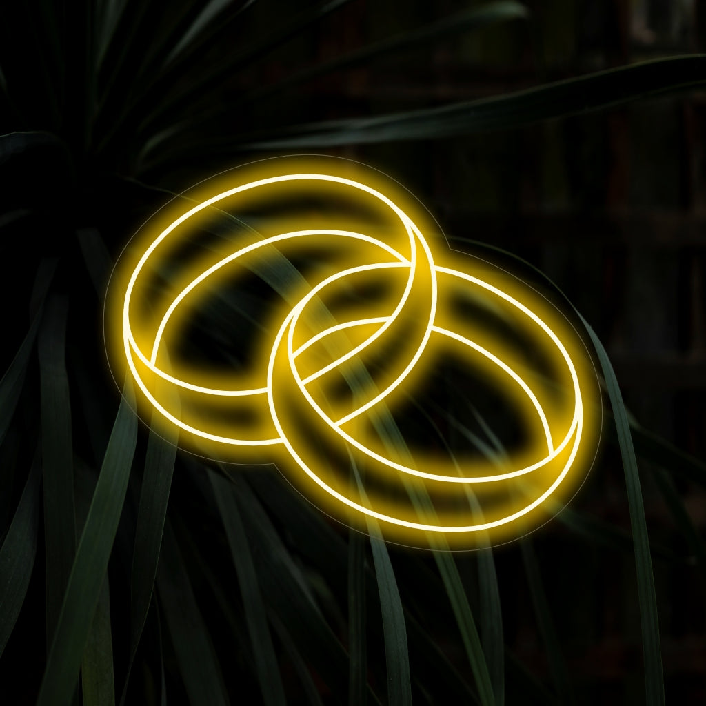 "Wedding Ring Neon Sign" tillför en touch av romantik med sin eleganta design, som ger en mjuk och förtrollande glöd som hyllar kärlek och engagemang.