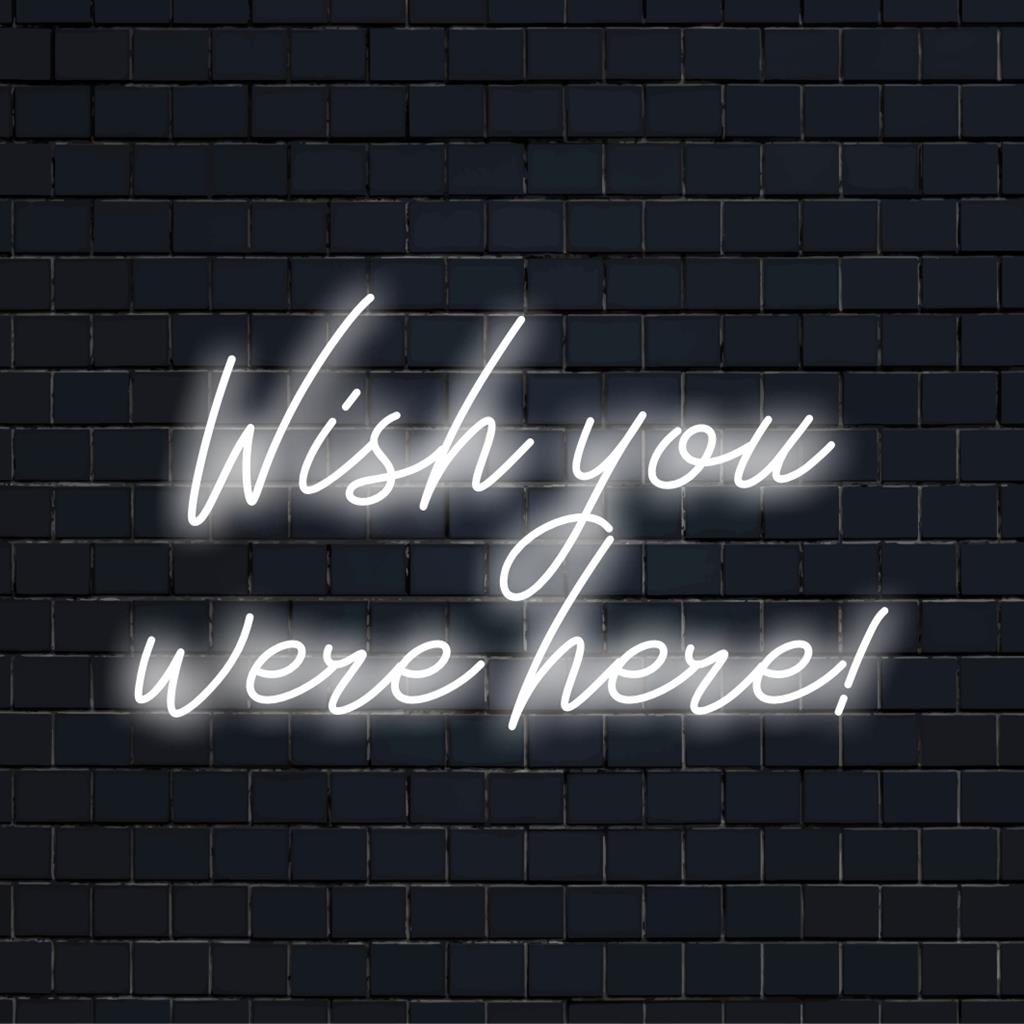 LED neonskylt lyser Wish You Were Here! i levande rosa, perfekt personlig neonkonst för att dekorera alla utrymmen.