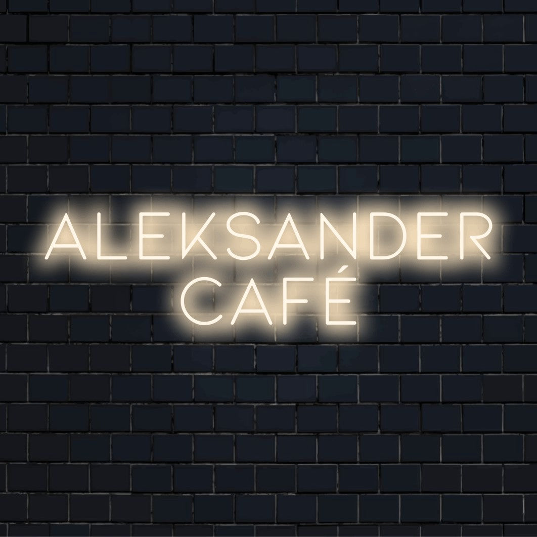 Aleksander Cafe Personalized Neon Light with glowing lettering on black brick background
