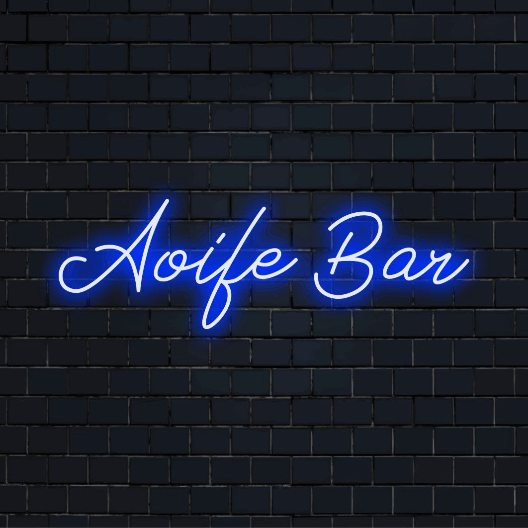 Aoife Bar Personalized Neon Light with glowing wall decor on dark brick wall