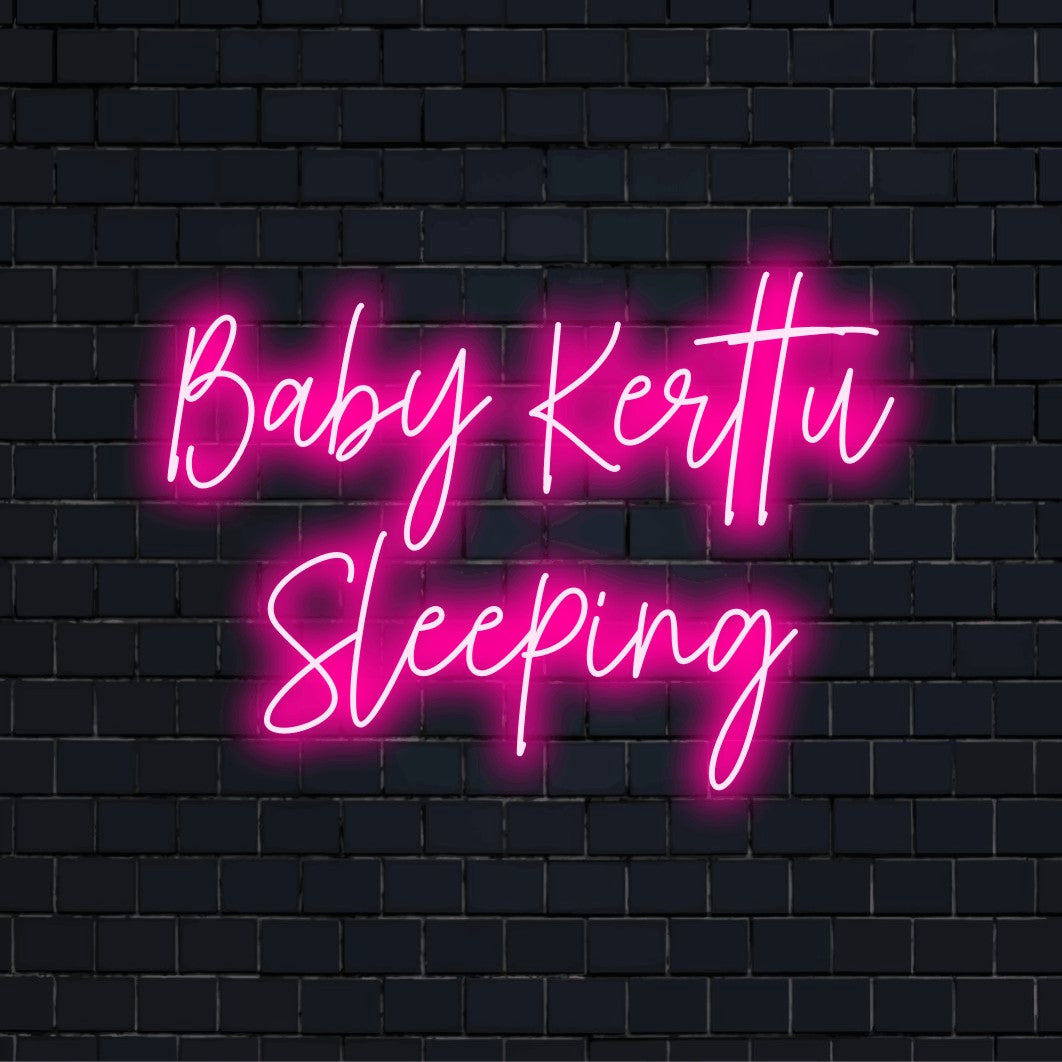 Baby Kerttu Sleeping Custom Name Neon Sign, glowing wall decor on dark brick wall