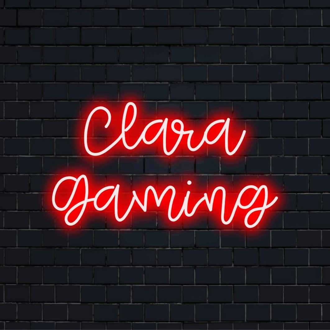Clara Gaming Personalized Neon Light with glowing lettering on dark brick background