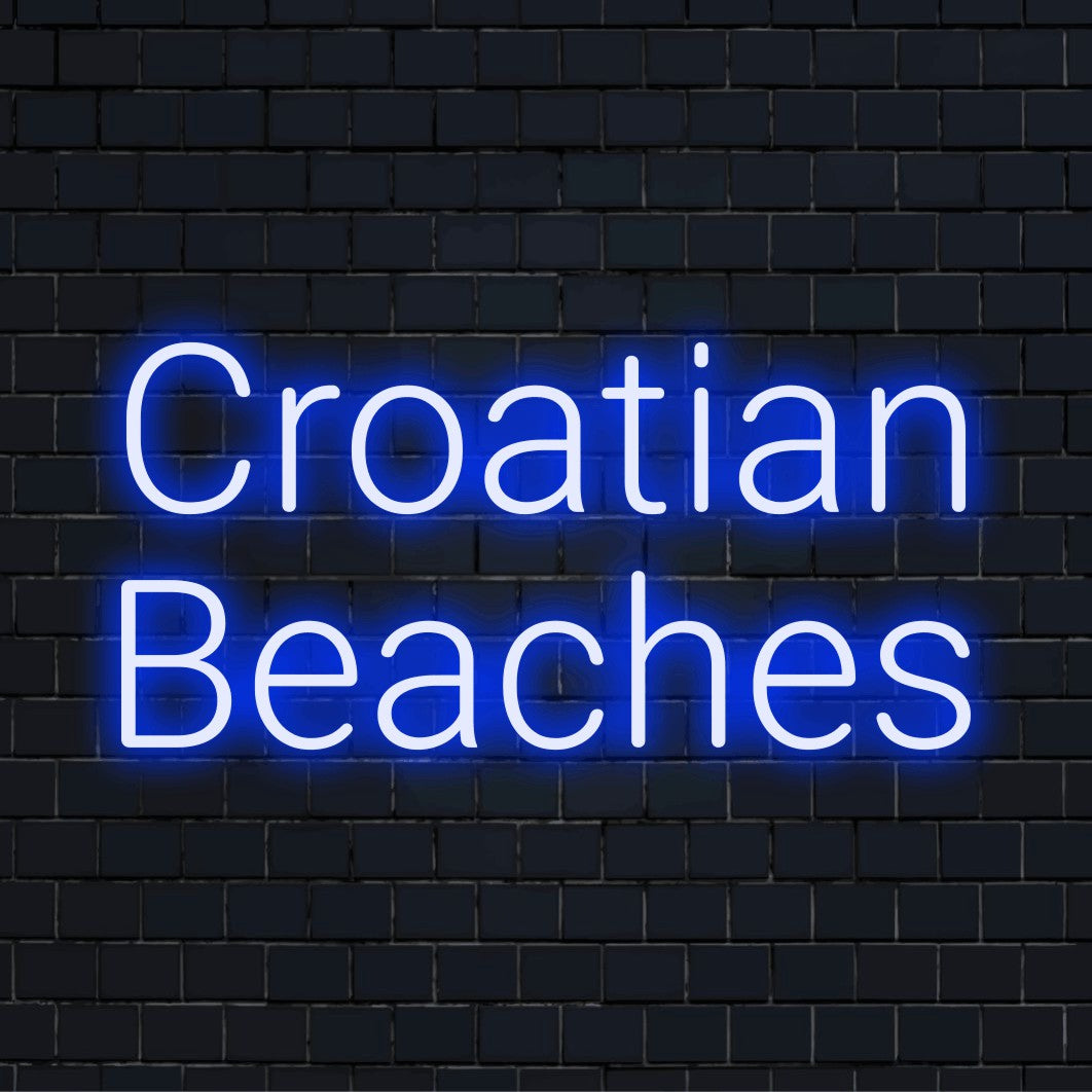 Croatian Beaches Neon Light with glowing neon text against black brick wall