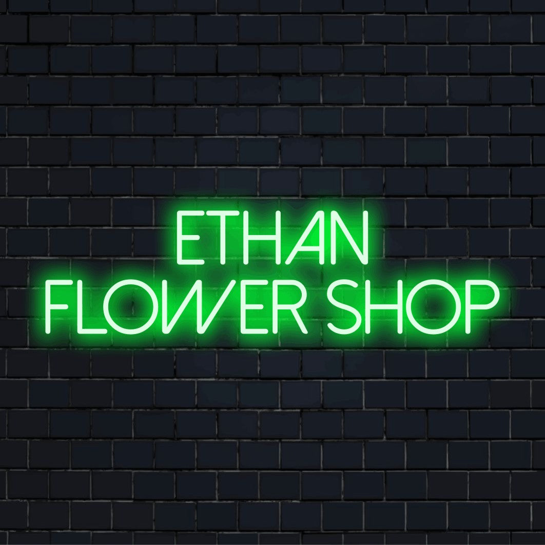 Ethan Flower Shop Custom Name Neon Sign, glowing wall decor on black brick background