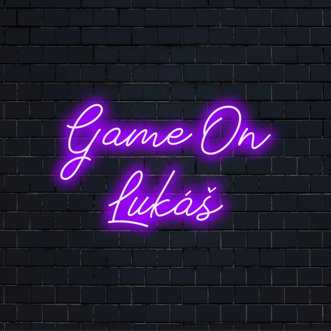 Game On Lukas Custom Name Neon Sign, bright neon glow on dark brick background