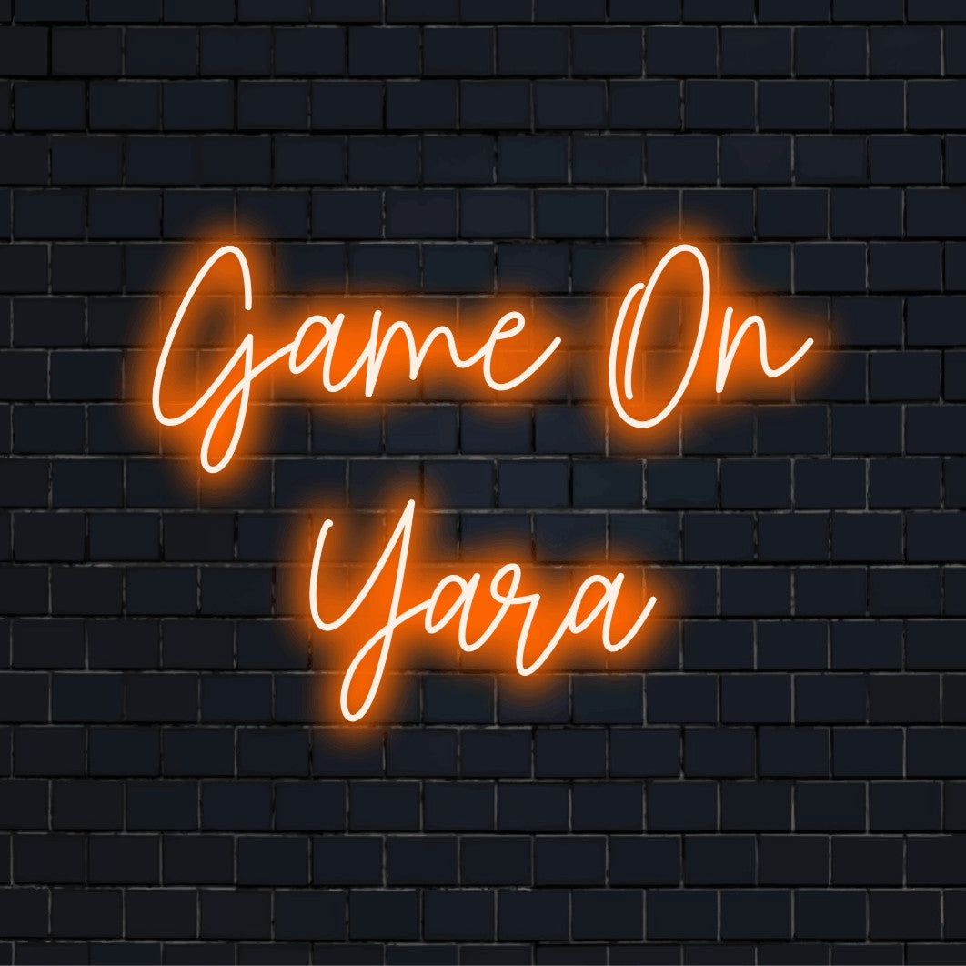 Game On Yara Personalized Neon Light with glowing lettering against black brick wall