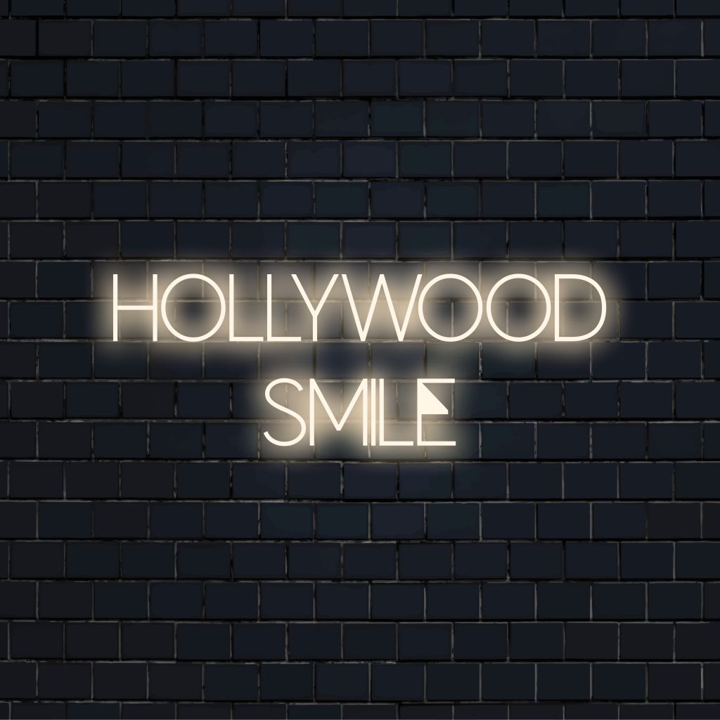 Hollywood Smile Neon Sign, glowing wall decor against black brick wall