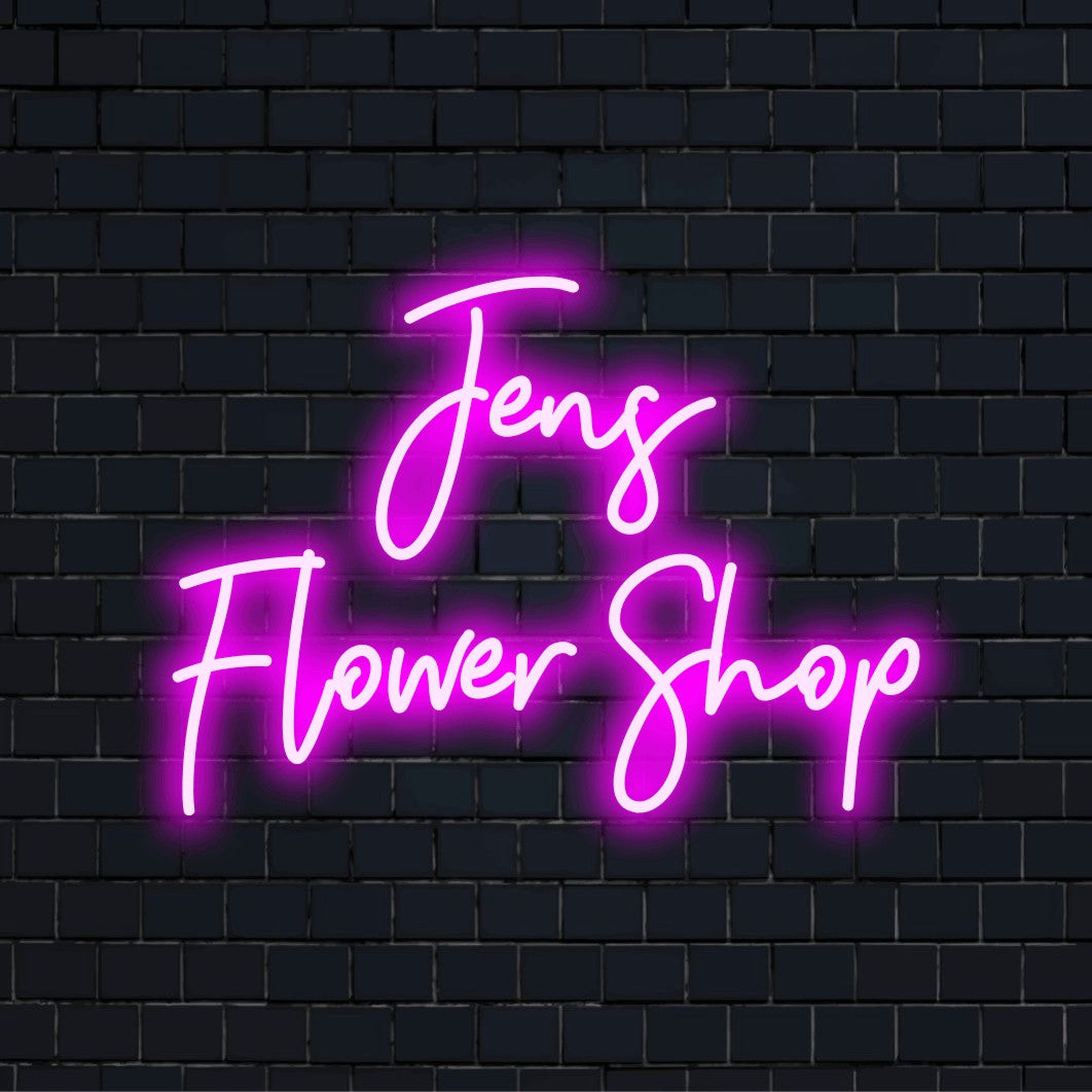 Jens Flower Shop Personalized Neon Light with bright LED glow against black brick wall