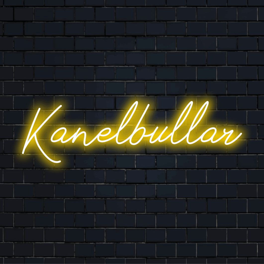 Kanelbullar LED Neon Sign, glowing lettering against brick backdrop