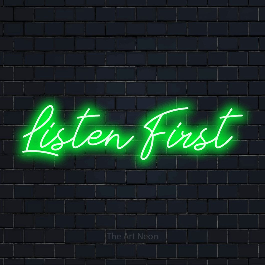 "Listen First" text design with neon effect on a black brick wall