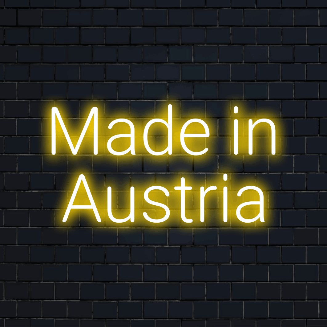 Made In Austria Neon Sign, bright LED glow on black brick background