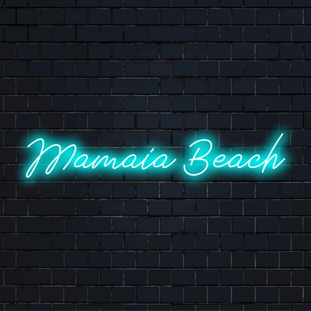 Mamaia Beach LED Neon Sign, neon text light against black brick wall
