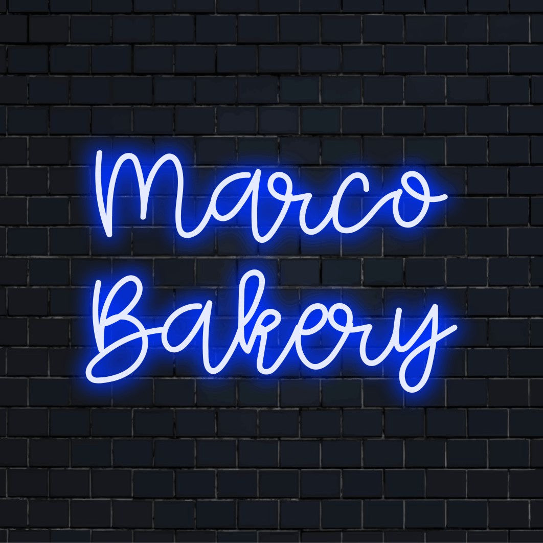 Marco Bakery Custom Name Neon Sign, soft neon glow against black brick wall
