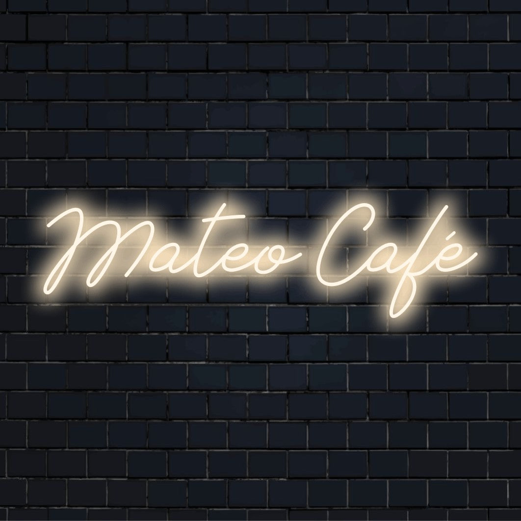 Mateo Cafe Personalized Neon Light with neon text light against brick backdrop