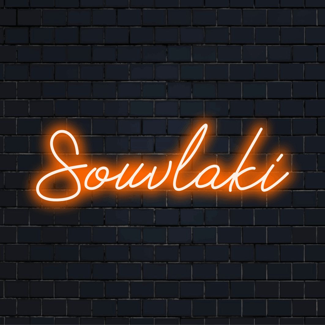 Souvlaki Neon Sign, glowing wall decor on dark brick wall