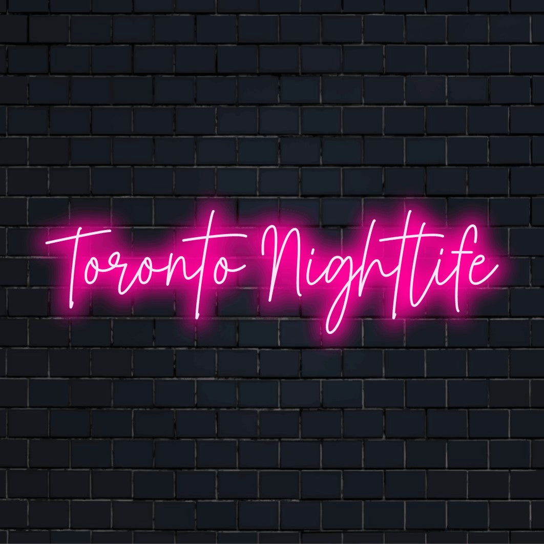 Toronto Nightlife Neon Light with neon text light on black brick background
