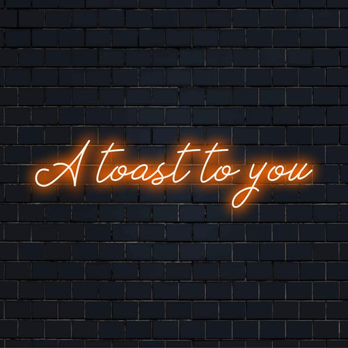 Anpassad LED-neonskylt med frasen A Toast To You i livfulla färger, perfekt för att sätta en festlig touch till vilket utrymme som helst.