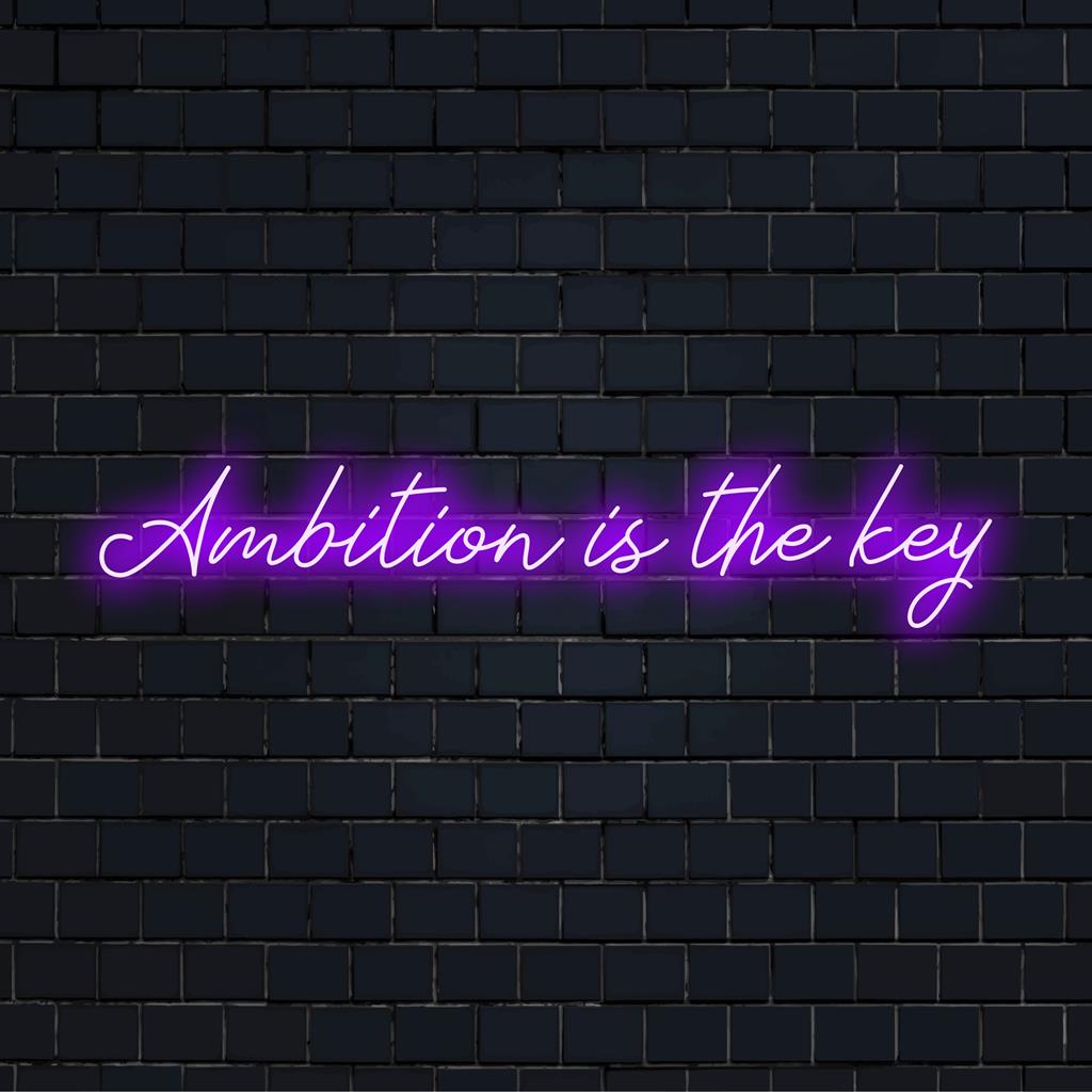 Skräddarsydd LED-neonskylt som visar Ambition Is The Key i livfulla färger, perfekt för personlig inredning.