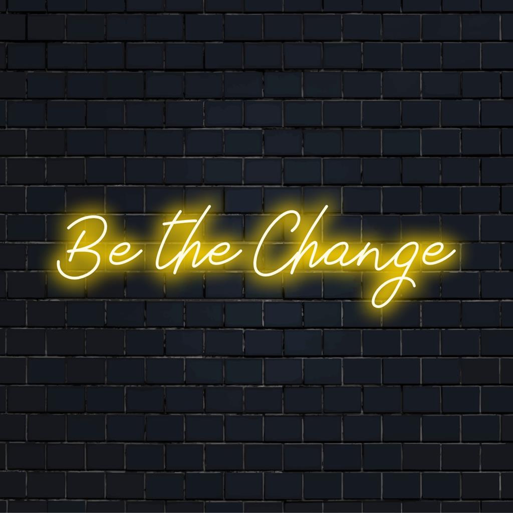 Skräddarsydd LED neonskylt stavning Be The Change, perfekt för att lägga till inspirerande neonljusdekor till alla utrymmen.