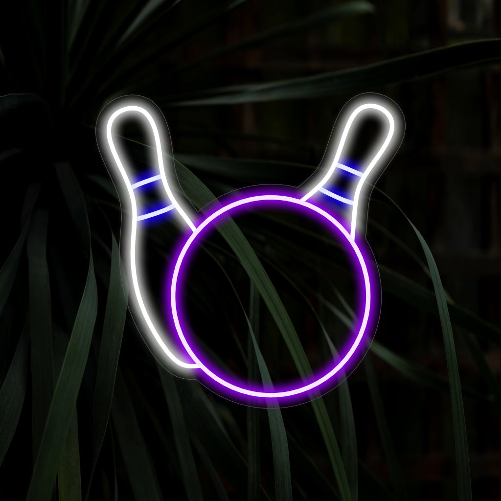 "Bowling Ball and Pins Neon Sign" captures the excitement of recreation with a dynamic illustration of a bowling ball striking the pins. This sports-themed neon light is a striking addition to your decor, perfect for enthusiasts of the game.