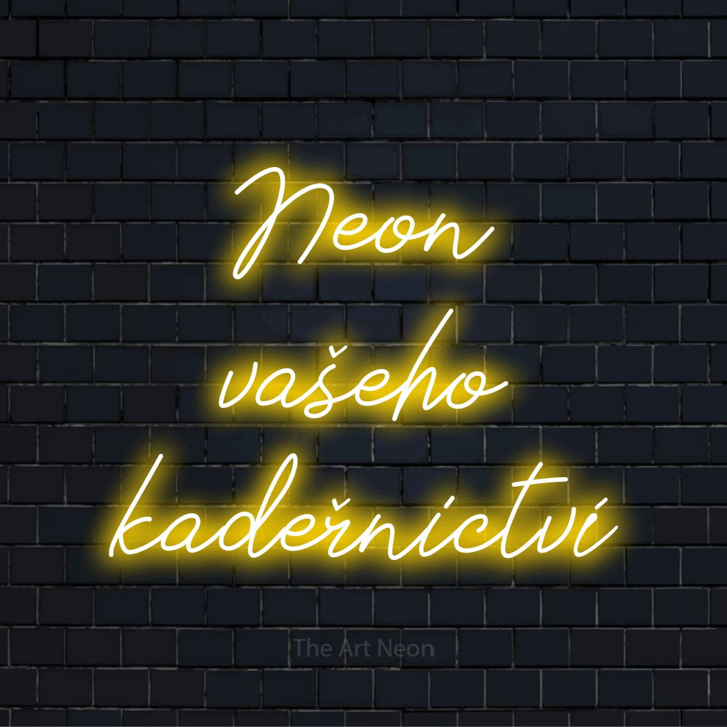 Neonový nápis na míru „Neon vašeho kadeřnictví“ na černé cihlové zdi