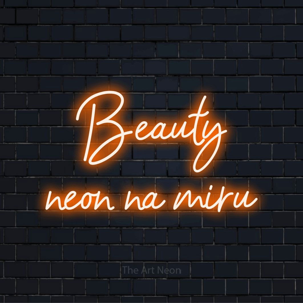 Neonový nápis na míru „Beauty neon na míru“ na černé cihlové zdi