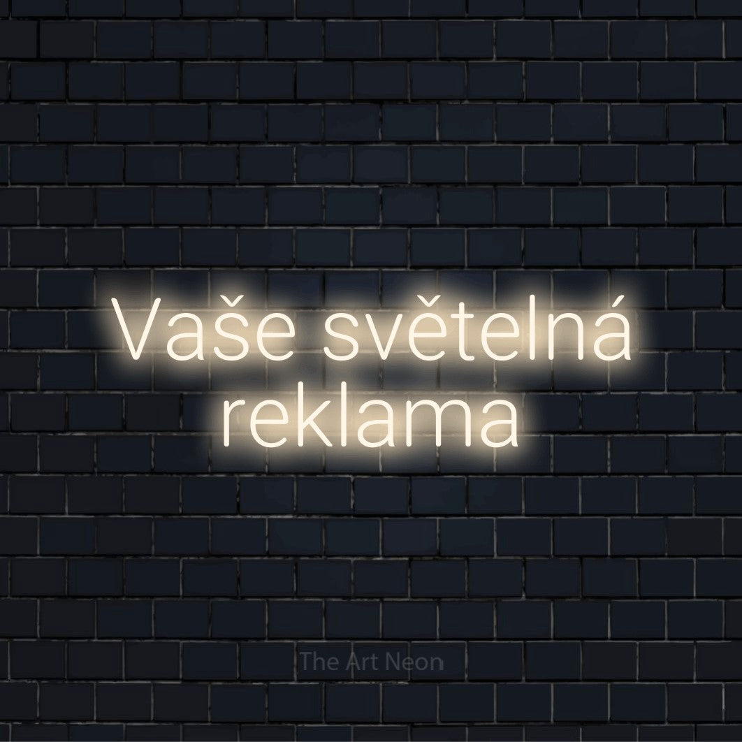 Neonový nápis na míru „Vaše světelná reklama“ na černé cihlové zdi