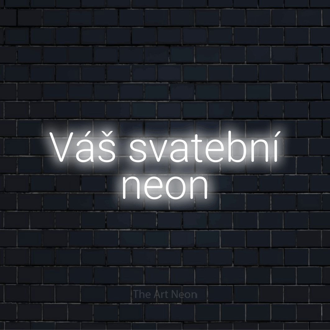 Neonový nápis na míru „Váš svatební neon“ na černé cihlové zdi
