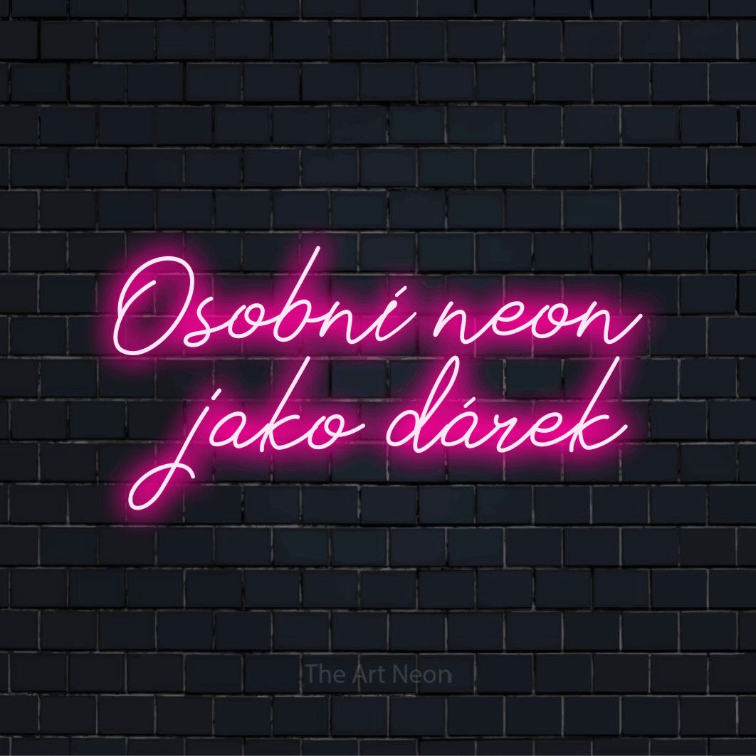 Neonový nápis na míru „Osobní neon jako dárek“ na černé cihlové zdi