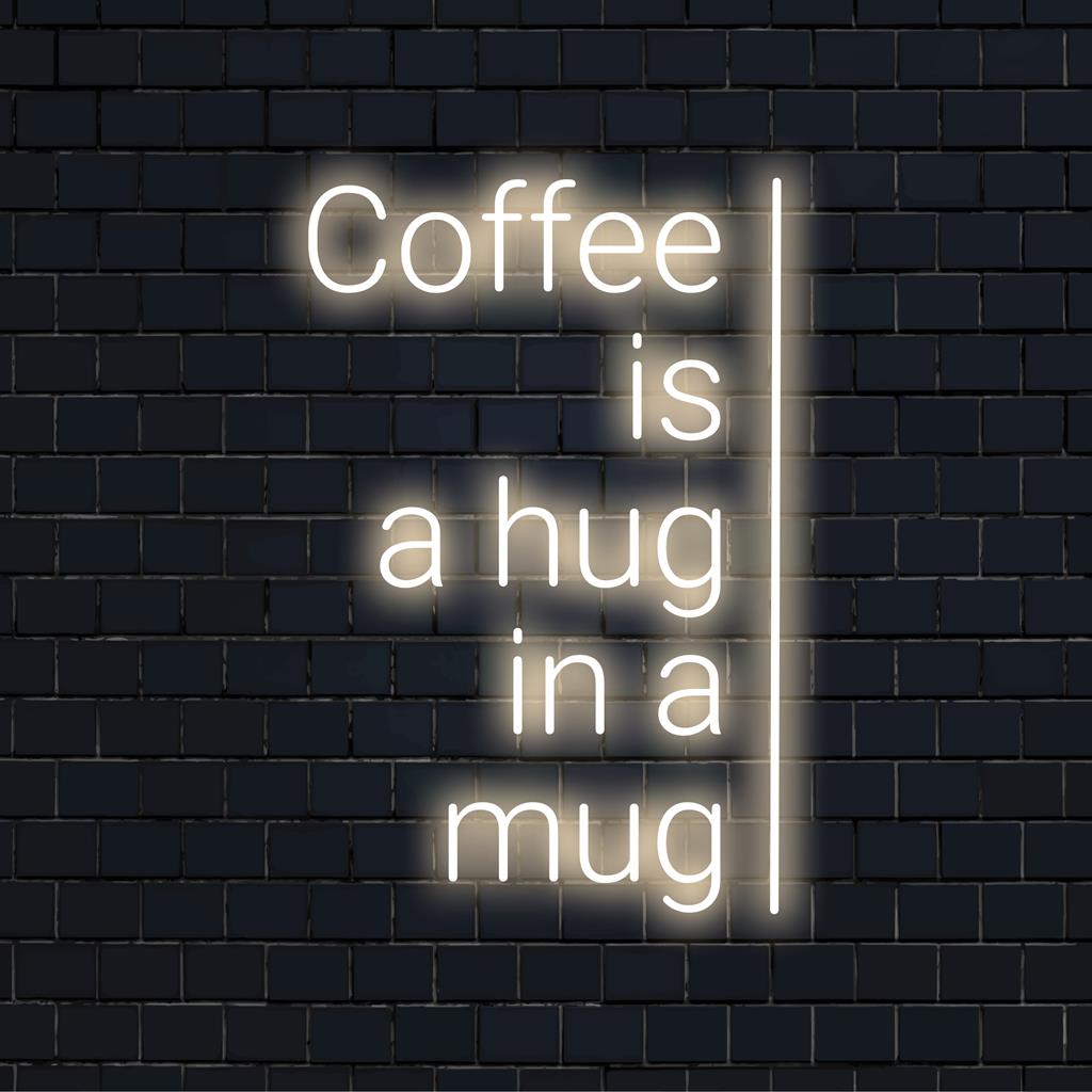 Custom LED sign displaying Coffee Is A Hug In A Mug in bright neon; perfect for cozy decor at home or cafes.